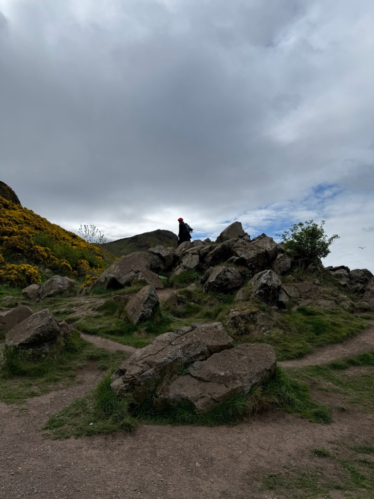 A rocky hill on a cloudy day