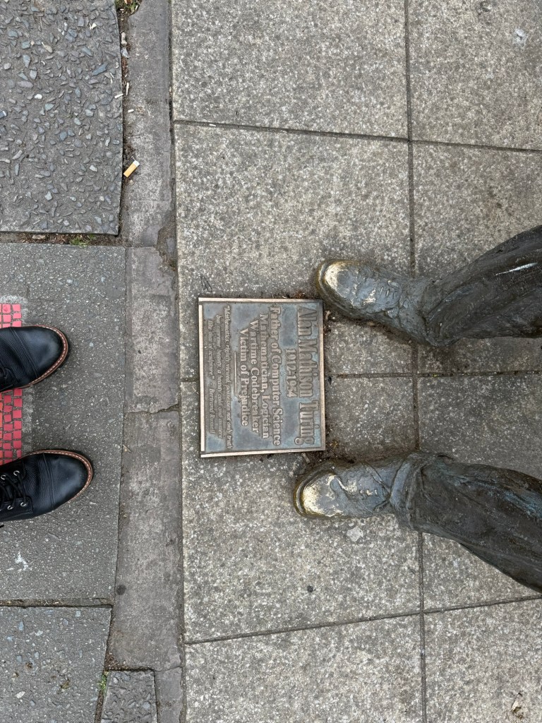 Alan Turing's plaque which reads: Father of Computer Science Mathematician, Logician Wartime Codebreaker Victim of Prejudice. "Mathematics, rightly viewed, possesses not only truth but supreme beauty, a beauty cold and austere lie that of sculpture." - Bertrand Russell