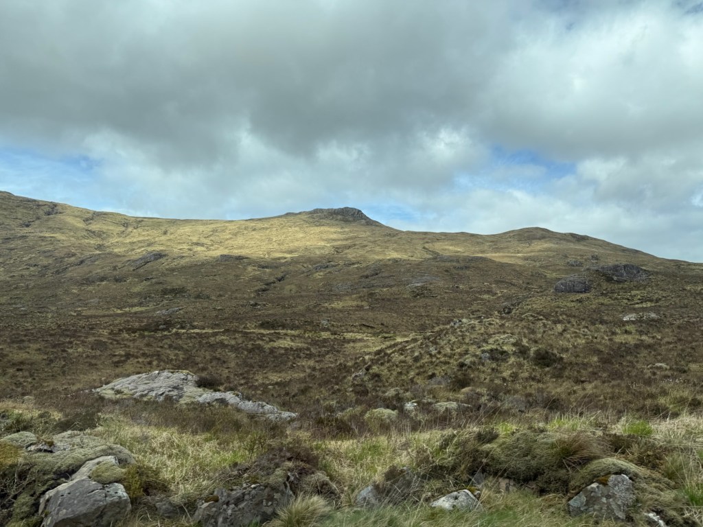 The Scottish highlands of mountains and grey skies