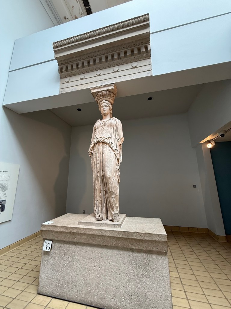 A woman sculpture that is also an architectural support like a pillar- a caryatid