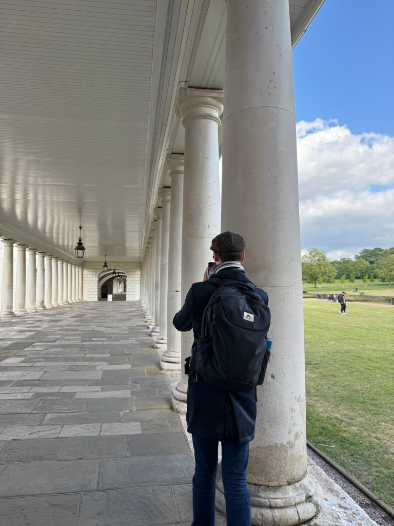 A man lines up a photo shot at the Maritime Museum